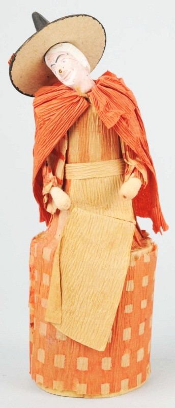 Early Tall Witch Candy Container.: Composition head, crepe paper outfit, and cardboard hat. Very delicate. Size: 6 - 1/2" T.