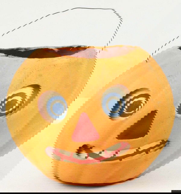 Paper Mache Orange Jack-O-Lantern.: German. Original paper label, eyes, nose, and mouth. Size: 8" W.