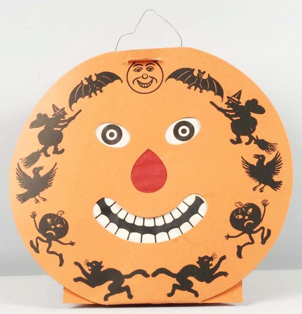 Cardboard Beistle 2-Faced Jack-O-Lantern.: German. Pictured on page 143 of Claire M. Lavin's "Timeless Halloween Collectibles". Size: 12" T.