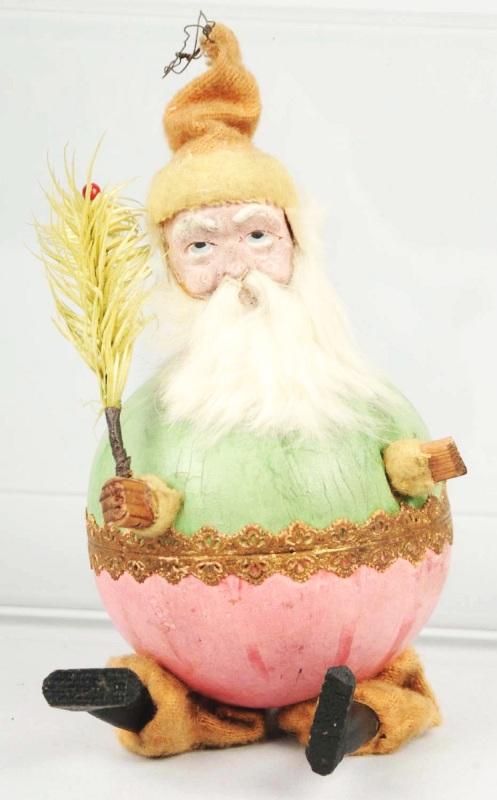Rare Dresden Santa Squeaker.: Round Dresden body with green on top and pink on bottom half. Has Dresden trim around entire body. Composition head, rabbit fur beard, fabric trousers, and wooden arms, legs, and feet. Size: