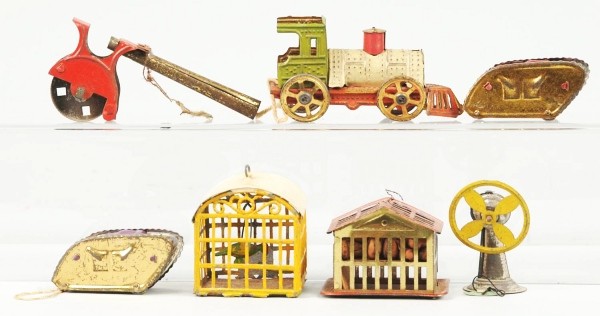 Lot of 7: Tin Christmas Ornaments.: Includes one train penny toy missing roof and bell. Also includes two tanks, two birds, one fan, and one blow pie. Size: Largest: 3" L.