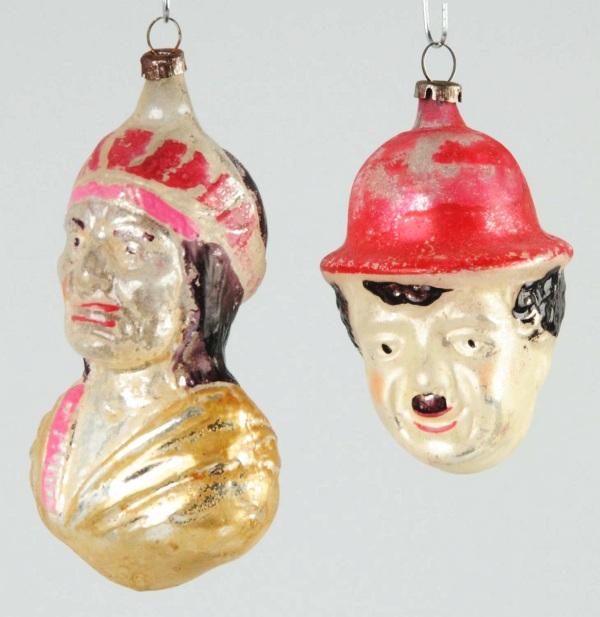 Lot of 2: Blown Glass Christmas Ornaments.: Includes Charlie Chaplin head and one Indian bust. Some paint loss throughout. Size: