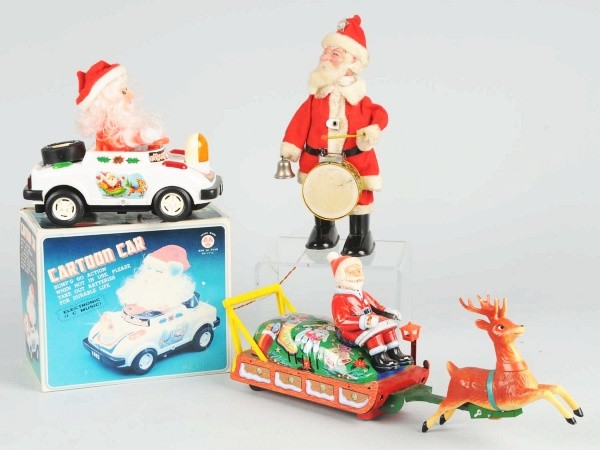 Lot of 3: Battery-Operated Santa Toys.: Includes one Cartoon Car in original box, one Santa in sleigh by TM Japan, and one Santa Playing Drums. Size: