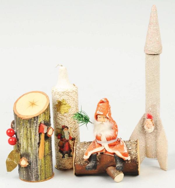 Lot of 4: Christmas Candy Containers.: Includes Santa sitting on log, Santa scrap candle, a Yule log, and a rocket. Size: Largest: 10" T.