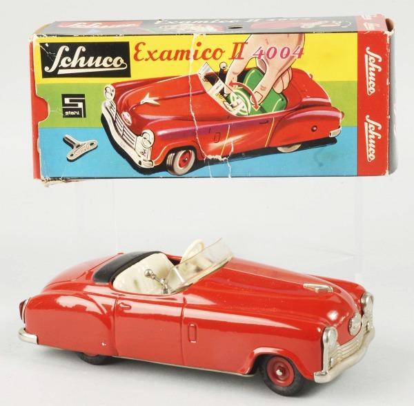 Tin Schuco Examico II 4004 Car Wind-Up Toy.: German. Car is in unused condition with original instructions and key. Includes original box marked "Made in Western Germany". Box has some tearing and creasing. 7 - 1/2" L. Toy (Near Mint) Box (Very