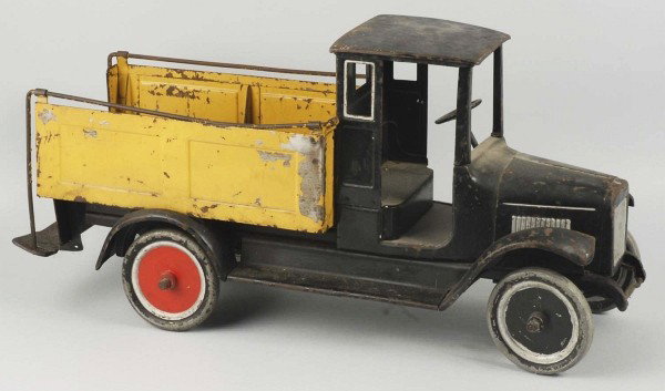 Pressed Steel Buddy L Ice Truck Toy.: Pre-war. Missing ice cubes and tongs. Truck is over-painted, has rust and paint chipping in bed, and a bend to one of the sidebars. 25 - 1/2" L. (Repainted).