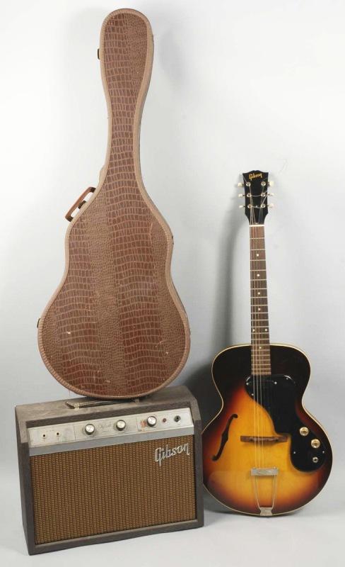 Gibson Guitar in Original Case with Amplifier.: Marked "Gibson" and "ES-120T". Plays well. Appears to be completely intact with no restoration or damage. Includes original leather alligator case. (Excellent).