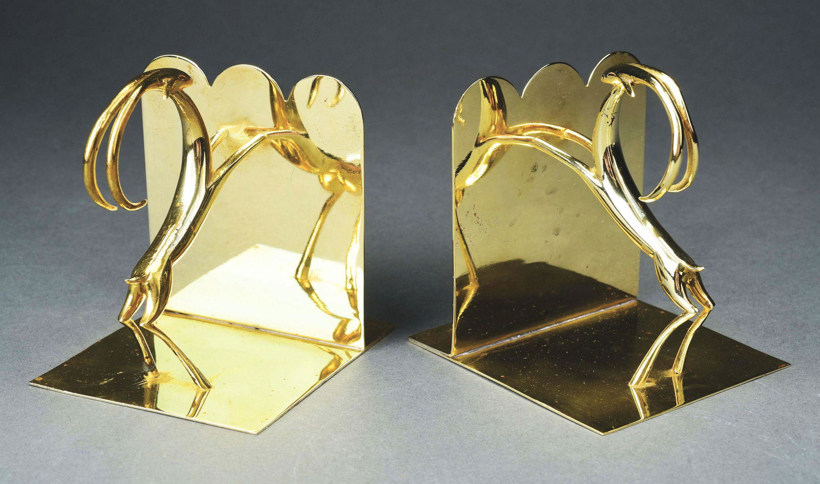 KARL HAGENAUER PAIR OF IMPALA BRASS BOOKENDS. (1 of 6)