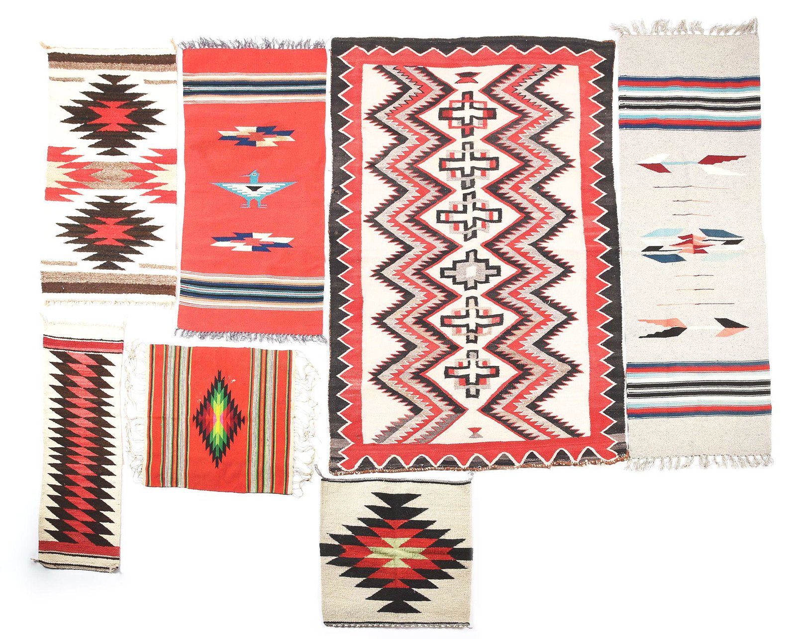 LOT OF 7: SOUTHWEST INDIAN AND MEXICAN RUGS.: Lot consists of: (A) 2 Navajo samplers and 1 floor rug. Largest Navajo measures 59" x 38". (B) 3 Mexican runners and 1 smaller Saltillo. CONDITION: Very good. BRM