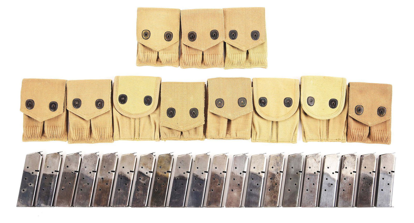 LARGE LOT OF WORLD WAR I M1911 MAGAZINES AND MAGAZINE: Lot consists of: (A) 11 double magazine pouches, 1 marked Russell and dated May 1918, and second marked SFM; balance unmarked. (B) 20 1911 magazines, 19 2 tone magazines, 1 full blued (American Pin Co