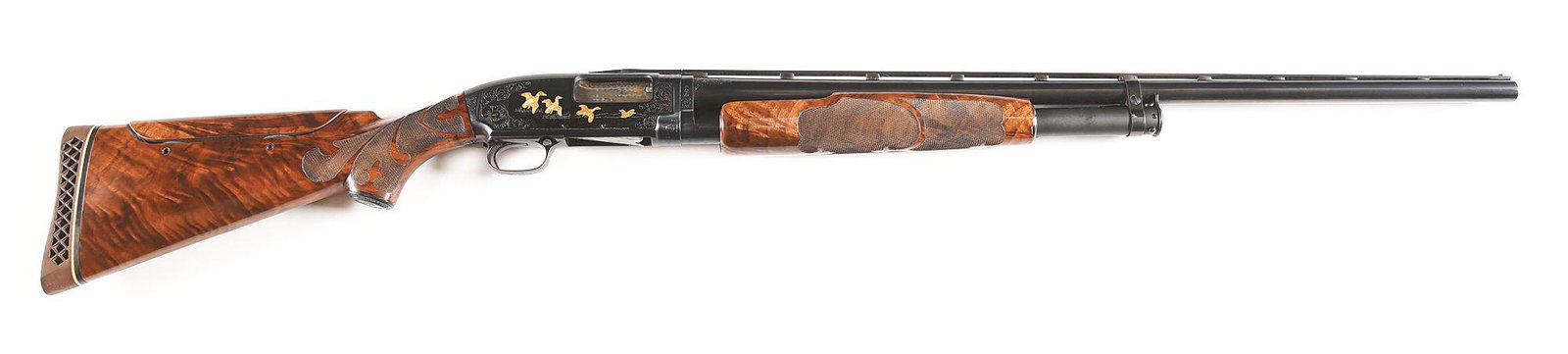 (C) WINCHESTER MODEL 12 PIGEON GRADE SLIDE ACTION: Winchester Model 12 Pigeon Grade slide action shotgun. Made 1958. Standard trademark and markings on the left side of the barrel. Winchester proof on the chamber. Matching serial numbers on the frame 