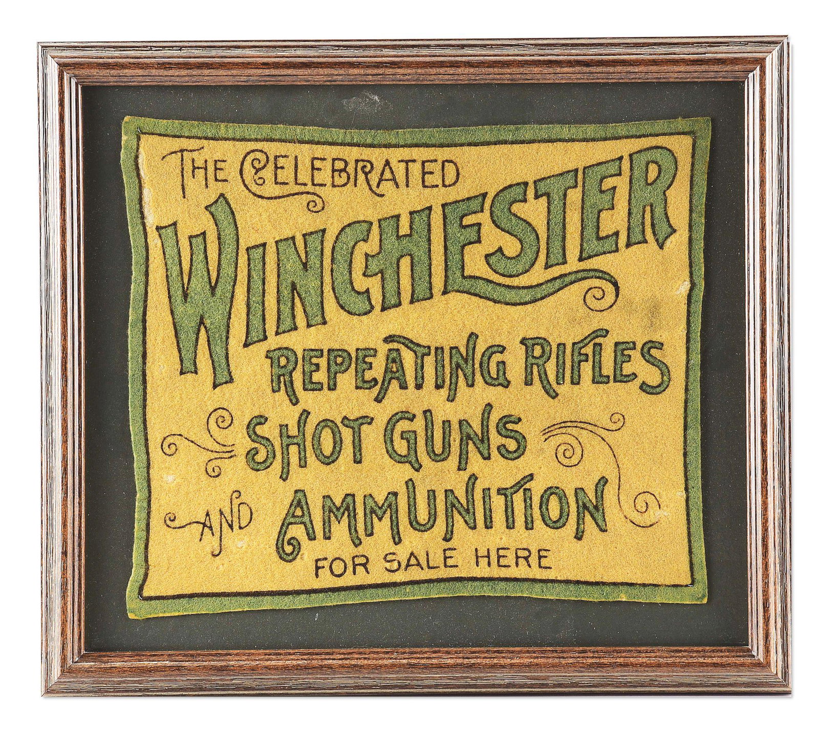 WINCHESTER GREEN ADVERTISING FELT.: Winchester Advertising Felt in aftermarket wooden frame. White background with green border and lettering reading "THE CELEBRATED / WINCHESTER / REPEATING RIFLES / SHOTGUNS / AND AMMUNITION / FOR SALE