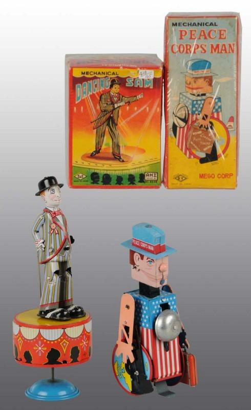 Lot of 2: Tin Litho Character Wind-Up Toys in O/B: Japanese. Working. Includes one Peace Corps Man with replacement suitcase and one Dancing Sam. Very little wear overall. Includes both original boxes. Largest: 9" L. (Excellent).
