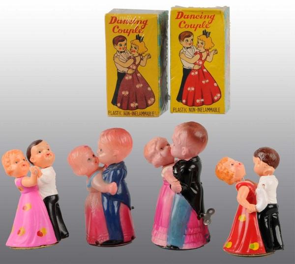 Lot of 4: Celluloid Dancing Couple Wind-Up Toys.: Japanese. Working. Includes two original boxes. Largest: 4 - 3/4" T. (Excellent).