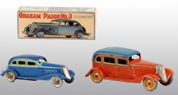 Lot of 2: Pre-War Tin Automobile Wind-Up Toys.: Japanese. 1930s. Working. Includes one Graham Paige with original box and one 1933 Ford with paint flaking on hood and right fender. Largest: 7" L. (Very Good).