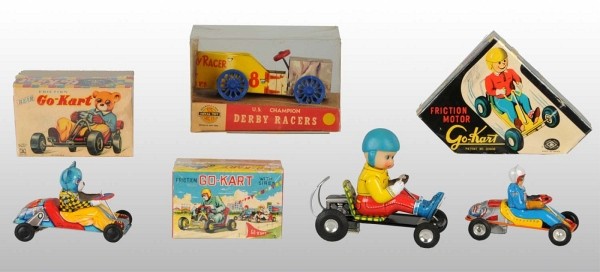 Lot of 4: Tin Go-Kart & Racecar Toys.: Working. Three are Japanese friction Go-Karts and one is an American Soap Box Derby Push Car. One Go-Kart has a bear driver. Includes all original boxes. Largest: 6 - 1/2" L. (Very Good - Excellent).