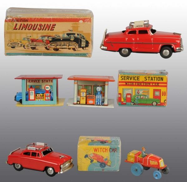 Lot of 5: Tin Automobile Friction & Wind-Up Toys.: Japanese. Working. Includes one Limousine with limousine plates, one wind-up Witch car, one Service Station with friction car, one friction Limousine, and one Service Station with gas island. Includes