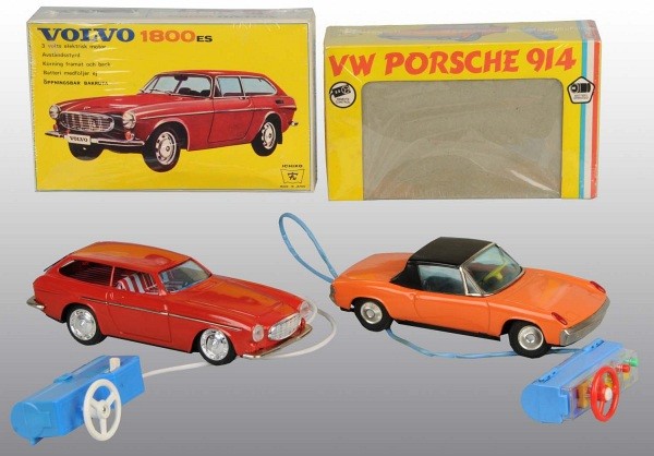 Lot of 2: Tin European Model Battery-Op Toys.: Japanese. Working. Both with remote control. Includes one Volvo 1800ES and one Porsche 914. Very little wear overall. Includes both original boxes. Largest: 9" L. (Excellent).