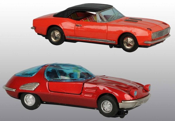 Lot of 2: Tin Chevrolet Auto Battery-Op Toys.: Japanese. Circa 1960s. Working. Includes one Camaro SS and one Corvair Bertone with lift-up middle section, plastic bubble, and vinyl driver. Some scratching and wear throughout. Bertone pictured in D