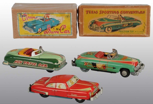 Lot of 3: Tin Litho Automobile Friction Toys.: Japanese. Working. Includes one Texas Sporting Convertible, one New Drive Car with lithographed puppy on trunk, and one 1955 V8 Super Sedan. Very little wear overall. Includes two original boxes. Larg