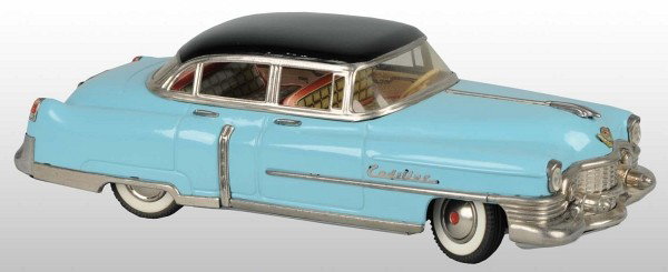 Tin Gama 1954 Cadillac Automobile Friction Toy.: Germany. Working. Marked "Made in Western Germany" on top of backseats. Unusual two-tone blue with black roof. Minor wear throughout. Pictured in Dale Kelley's "Collecting the Tin Toy Car" book on pag
