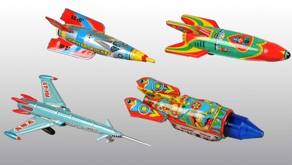 Lot of 4: Tin Space Rocket Friction Toys.: Working. Includes one Japanese Jupiter Rocket, one Indian Air Rocket, one Chinese Universe Rocket, and one contemporary Japanese Mars Patrol Rocket. Some scratching and wear. Includes all original box
