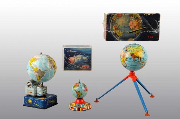 Lot of 3: Tin Space Globe Toys.: Includes one German Gama Zooming Satellite with original box, one German wind-up Globe toy on base, and one Japanese Globe toy with rotating styrofoam ball. Includes two original boxes with some wear.