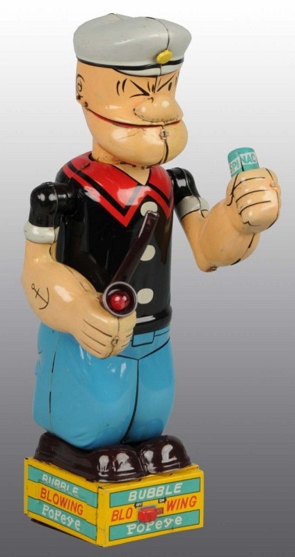 Tin Bubble Blowing Popeye Battery-Op Toy.: Japanese. Working. Made by Linemar. Marked "King Features Syndicate" on back of toy. 12" T. (Very Good - Excellent).