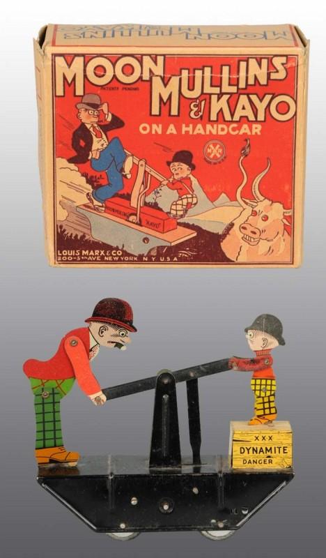 Tin Marx Moon Mullins & Kayo Handcar Wind-Up Toy.: American. Working. Floor version with Kayo sitting on dynamite box. Nice lithography on figures. Very little wear overall. Includes original complete box with slight creasing to one side. (Excellent).