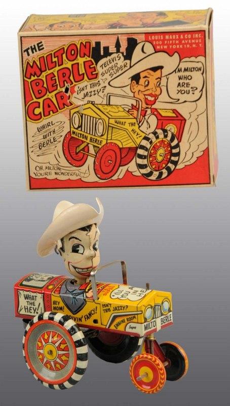 Tin Marx Milton Berle Car Wind-Up Toy.: Featured famous TV star. This is the rarest variety with tan hat instead of the more common red hat. Also has red/yellow wheels instead of black/brown. Includes original box. Old store stock. 5 - 1/2"