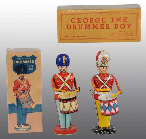 Lot of 2: Tin Litho Drummer Boy Wind-Up Toys.: American. Working. Includes one Marx George the Drummer Boy and one Chein No. 109 Mechanical Drummer. Minor scratching and wear. Small marks to drum head where drumsticks hit. Includes both original b