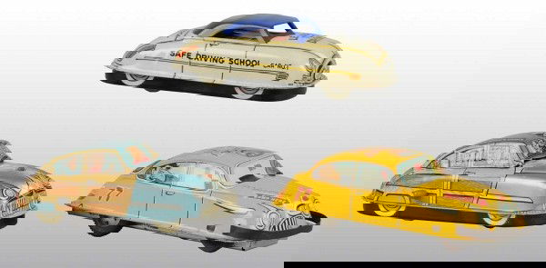 Lot of 3: Tin Marx Car Toys.: American. Working. Includes one friction Wacky Taxi, one wind-up Woody Wagon with lithographed people in windows, and one wind-up Student Driving Training Car. All three have some scratching and wear.