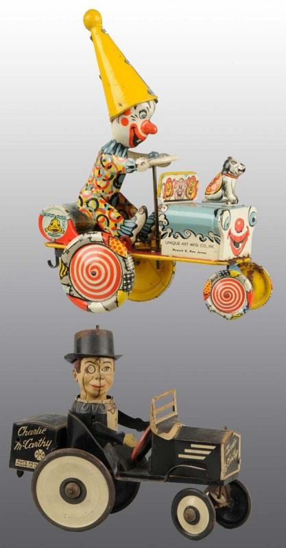 Lot of 2: Tin Character Whoopee Car Wind-Up Toys.: American. Working. Includes one Marx Charlie McCarthy Benzene Buggy with black wheels and original hat and one Unique Art Artie Clown Car with box but missing rubber ears. Charlie McCarthy's hat has s