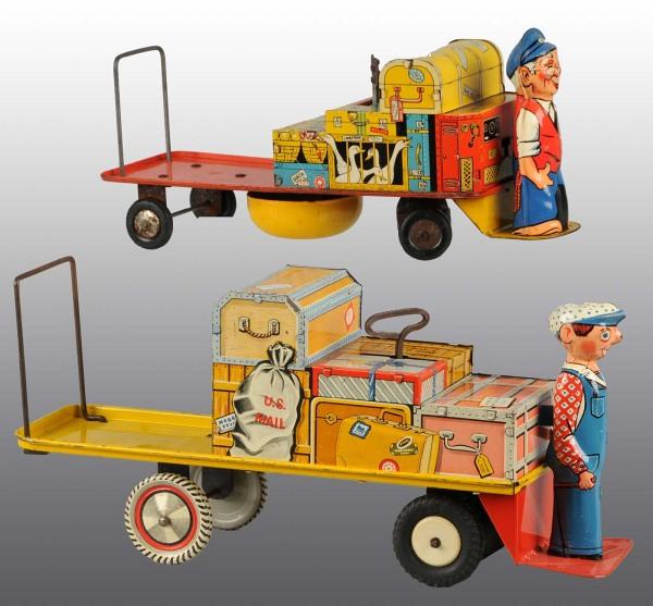 Lot of 2: Tin Finnegan Baggage Cart Wind-Up Toys.: Includes one made by Unique Art and one made in Great Britain. Both with moderate overall scratching and wear. Largest: 13 - 1/2" L. (Very Good).