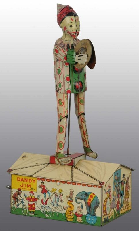 Tin Litho Unique Art Dandy Jim Roof Wind-Up Toy.: American. Working. When in operation, clown playing cymbals dances on roof. Nice lithographed circus scenes around base. Some scratching and wear to figure. 10" T. (Very Good - Excellent).