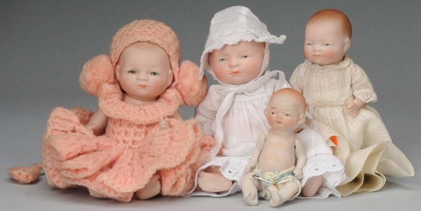 Lot of 3 Grace S. Putnam All Bisque Bye-Lo Babies: Germany, Ca. 1923. 6" fully marked on back with painted eyes, original gown and hat; 4 ½" with painted eyes, original gown; 6" with sleeping eyes, swivel neck, pink crocheted outfit. With Japanese al