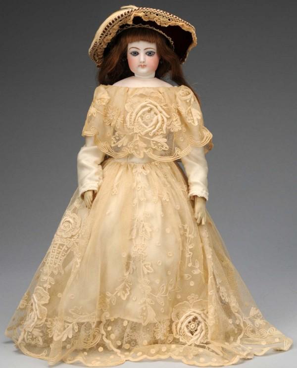 French Fashion Lady Poupée Peau.: Paris, 1870s. Bisque socket head 4 on marked FG shoulder plate, multi-stroked eyebrows, blue paperweight eyes with darker outlined irises, painted upper and lower eyelashes, closed mouth with shading 