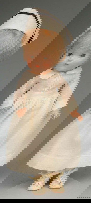 Hard-to-Find Madame Alexander Nurse.: American, 1935. For the Dionne Quintuplets. All composition, sleeping eyes, closed mouth, rosy cheeks, original blonde mohair wig (sparse in back). Tagged white nurse outfit, cap, undies, shoes and so