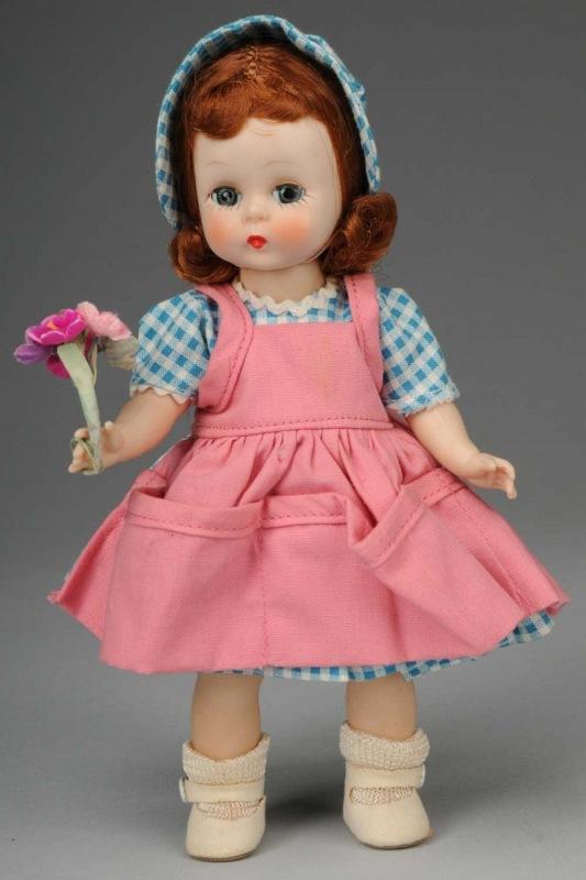 Sweet Madame Alexander Wendy.: American, 1955. All hard plastic straight leg walker, rosy cheeks, auburn hair, blue eyes. Factory original tagged "Alexander-Kins" outfit with blue checked dress and matching hat, pink pinafore, undi