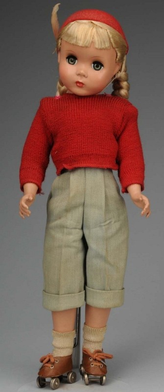 Sweet Madame Alexander "Polly Pigtails".: American, 1949. All hard plastic, large lashed blue sleeping eyes, blonde floss hair pigtails in original set with hair bows, closed mouth, Factory original tagged pedal pushers, red knit sweater, red
