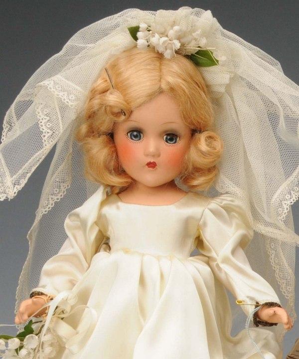 Choice Boxed Madame Alexander "Wendy Ann Bride".: American, Ca. 1940s. All composition, original blonde mohair wig, clear lashed blue sleeping eyes, eye shadow, rosy cheeks, closed mouth. Original satin gown with gold brocade trim, lovely tulle veil,