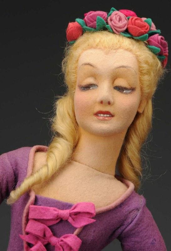Lovely Lenci Lady Doll #250 "Mimi".: Italy, Ca. 1920s. Lovely face (some restoration), brown side-glancing "bedroom" eyes, open mouth with painted teeth, blonde mohair wig with long side curls and lots of roses at the crown, all original
