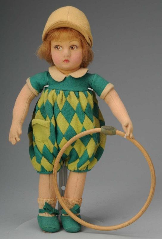 Rare Cloth Lenci Toddler with Hoop.: Italy, Ca. 1930s. Molded felt face (some discrete restoration) with detailed brown side-glancing eyes, bobbed tosca mohair wig, all original in harlequin sunsuit with hat, shoes and socks. Original wo