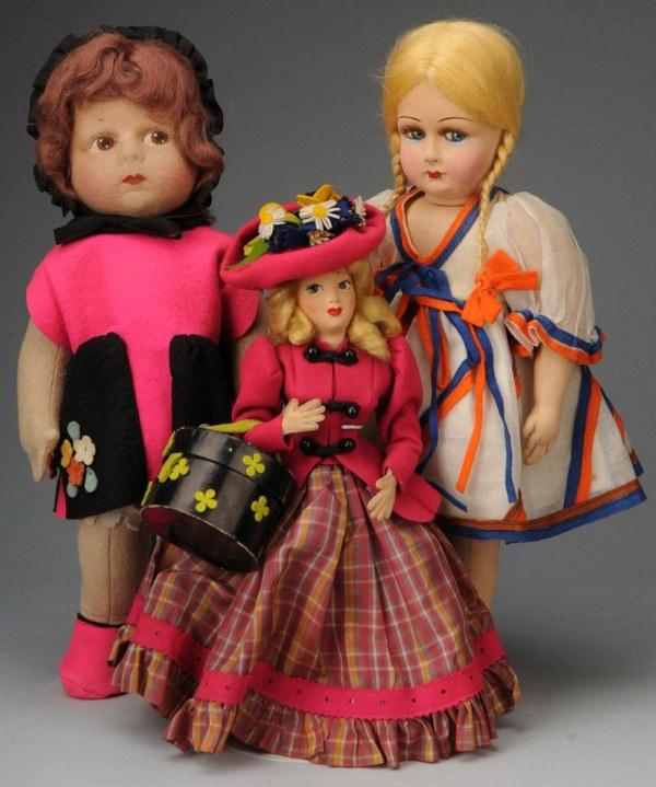 Lot of 3 Unmarked Cloth Dolls.: Ca. 1930s. All felt chubby child, probably Eugenie Poir, brown side-glancing eyes, auburn mohair wig, all original shocking pink and black outfit with black velvet bonnet, undies and shoes. Girl with 