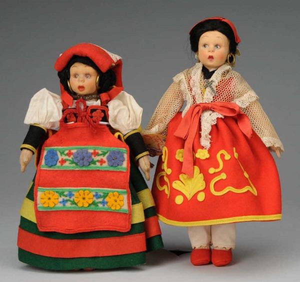 Lot of 2 Lenci Mascotte Dolls in Folk Costumes.: Italy, Ca. 1930s. Peasant girl with colorful rosy cheeks, black felt hair with coiled braids, metal hoop earrings, brown side-glancing eyes, totally original red, green, and yellow felt dress, apron,