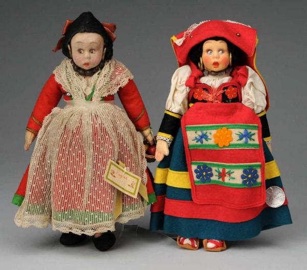 Lot of 2 Lenci Mascotte Dolls in Folk Costumes.: Italy, Ca. 1930s. Peasant girl with colorful rosy cheeks, black felt hair with coiled braids, metal hoop earrings, blue side-glancing eyes, totally original red, green, and yellow felt dress, apron, w
