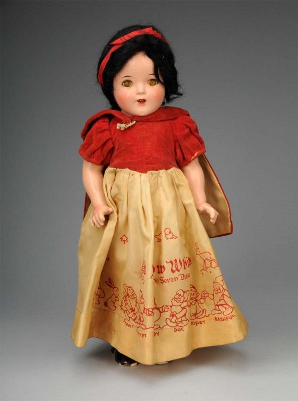 Ideal Snow White.: American, Ca. 1937. All composition (light overall crazing), lashed sleeping eyes, original black mohair wig, open mouth, rosy cheeks. Factory original tagged Ideal Snow White outfit with Disney motif