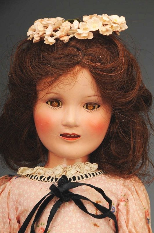 Lovely Ideal Teenage Star "Judy Garland".: American, 1938. All composition (light overall crazing), lashed sleeping eyes (crackled), rosy cheeks, open mouth with teeth, original human hair brown wig with flower wreath. Factory original pink pr
