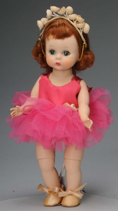 Sweet Madame Alexander Wendy.: American, Ca. 1956. All hard plastic, bent knee walker, auburn hair, dark eyes. All original in tagged #564 "Wendy Loves Ballet Lessons" in rose tutu and ballet slippers. 8" T. (Excellent).