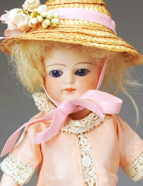 Lovely All Bisque Mignonnette.: German/French, Ca. 1880. Probably made by Simon & Halbig for French trade. Bisque head swivel neck, cobalt blue glass eyes, multi-stroked eyebrows, closed mouth, 5-piece bisque body with leather lined